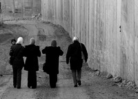 "Dead End" (2004):  Palestinian women walking along the Wall in Abu Dis.