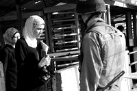 "Checkpoint" (2007):  Palestinian woman avoiding looking at Israeli soldier at Huwara checkpoint.