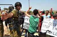 "Bil'in" (2010):  Israeli commander telling me to move at protest against the Wall in Bil'in.