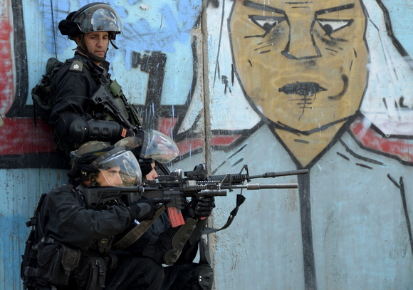 "Land Day" (2012).  "Israeli sharpshooters taking aim at peaceful protesters at Qalandia.