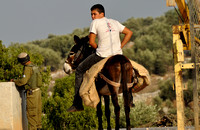 "Waiting" (2010):  Young farmer from Jayyous waiting to go back to the village after a day's work.