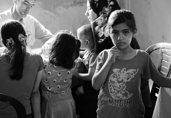 "Doctor's Visit" (2006).  Family treated at mobile clinic of Palestinian Medical Relief Society.