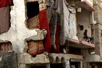 "Coping Amid Ruins" (2014).  Apartment building in Gaza City bombed by Israel in 2014.
