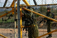 "Opening the Gate" (2004).  Israeli soldiers unlocking the gate in the Wall at Qalqilya.