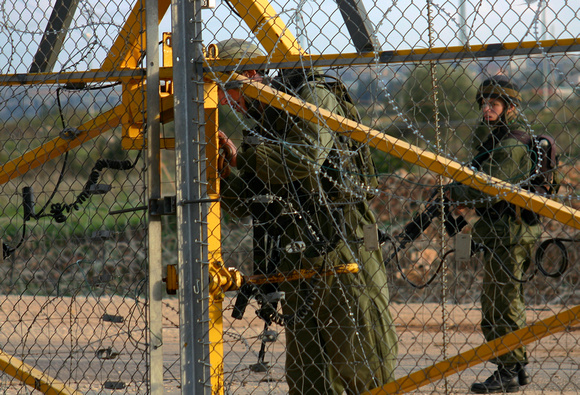 "Opening the Gate" (2004).  Israeli soldiers unlocking the gate in the Wall at Qalqilya.