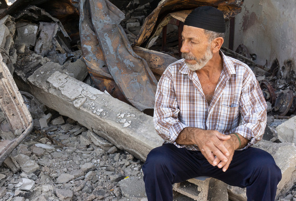 "Fishing No More" (2014):  Fisherman at Gaza Port in front of his bombed locker.