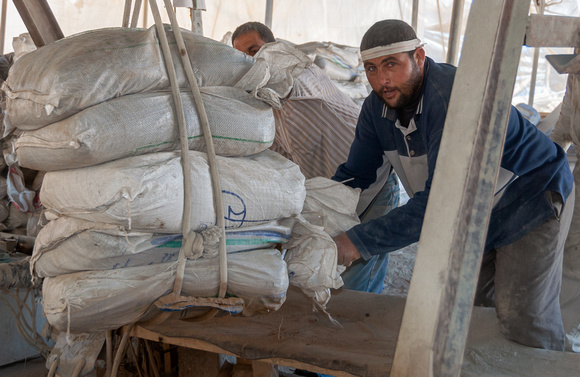 "Tunnel Work" (2011): Unloading sacks of flour from tunnels when they were still operating in Rafah.